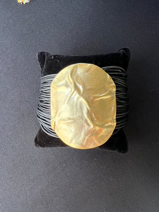 Leather strap round gold bracelet